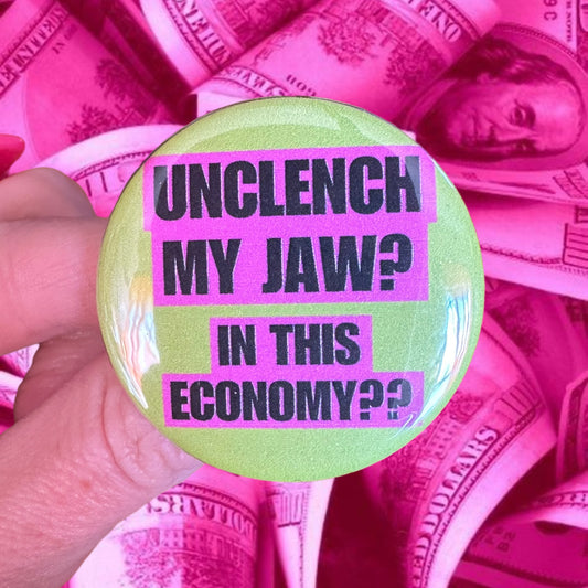 Button 1.75” diameter “unclench my jaw? In this economy??” Lime Green Pink Black